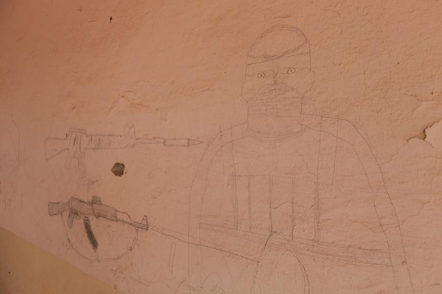 A drawing left by ISIS militants adorns the wall of a school after Iraqi forces recaptured Qayyarah, Iraq, on Nov. 17.