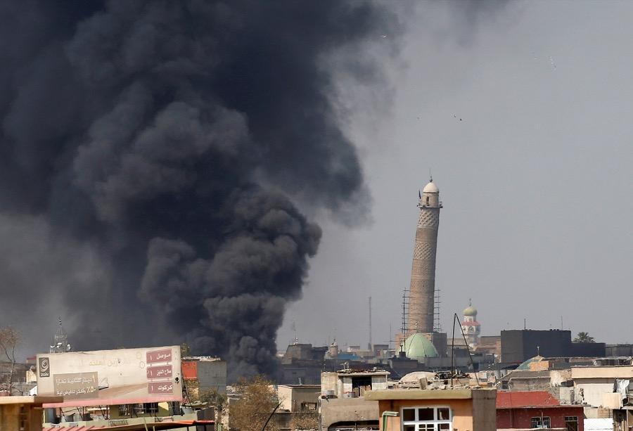Smoke rises from clashes on March 17 near Mosul's al-Habda minaret at the Grand Mosque, where ISIS leader Abu Bakr al-Baghdadi declared his caliphate back in 2014.
