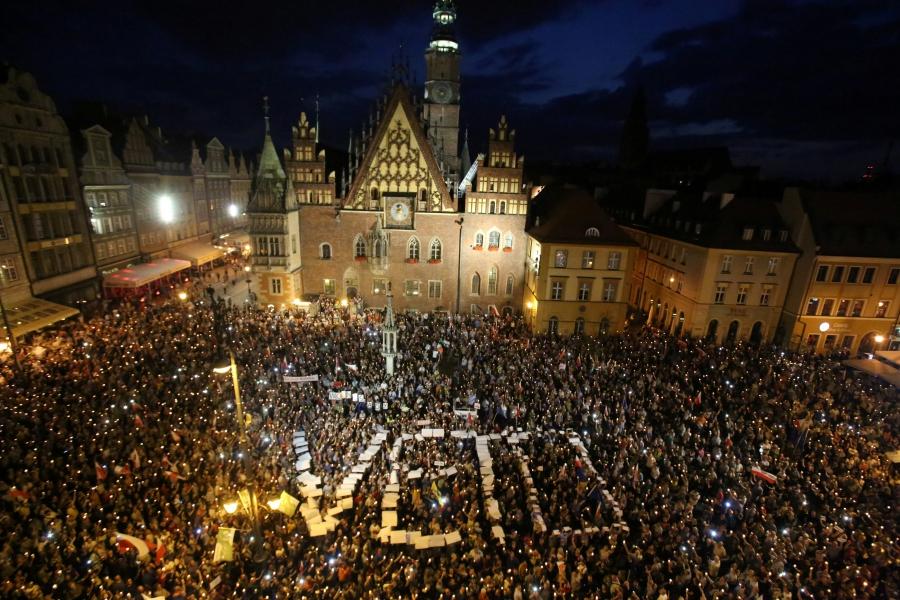 People attend a protest against supreme court legislation in Wroclaw, Poland