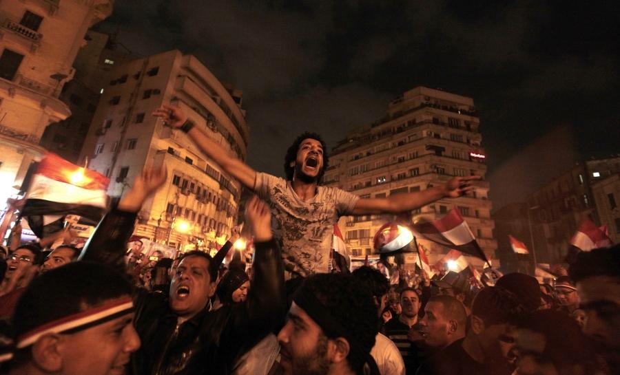 Anti-government protesters celebrate in Tahrir Square after the announcement of Egyptian President Hosni Mubarak's resignation in Cairo, Feb. 11, 2011.