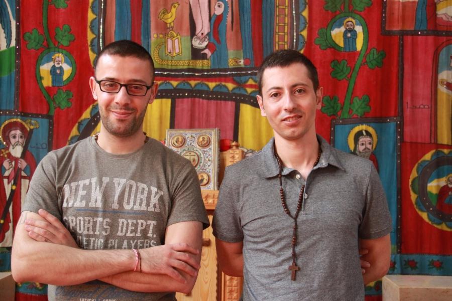 Tarek Bakhous (l) and Wassim Awad, two Syrian Christian refugees, in the Syriac Orthodox Church of Antiochia in Berlin, where the liturgy is in Syriac, a dialect of Aramaic. 