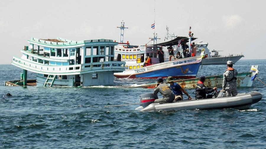 An illegal fishing boat, seized by Thai officials, sinks off the coast of Phetchaburi province, Thailand.