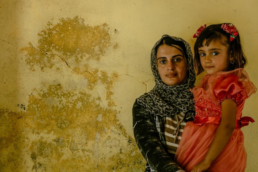 Turkia Hussein, 25, and her 2-year-old daughter Riwazi.
