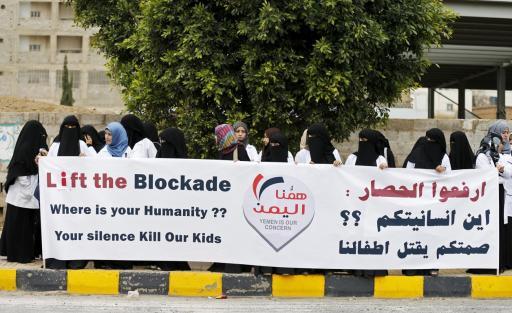 Healthcare workers demonstrate against the blockade outside the UN headquarters in Sanaa.