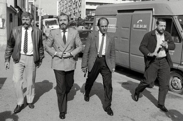Judge Giovanni Falcone (second from left) with bodyguards during a visit to Marseilles
