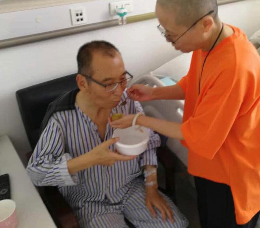 Chinese democracy activist Liu Xiaobo, imprisoned on the charge of subverting state power and suffering from terminal liver cancer, is fed by his wife Liu Xia on a rare visit, shortly before he died on July 13, 2017.