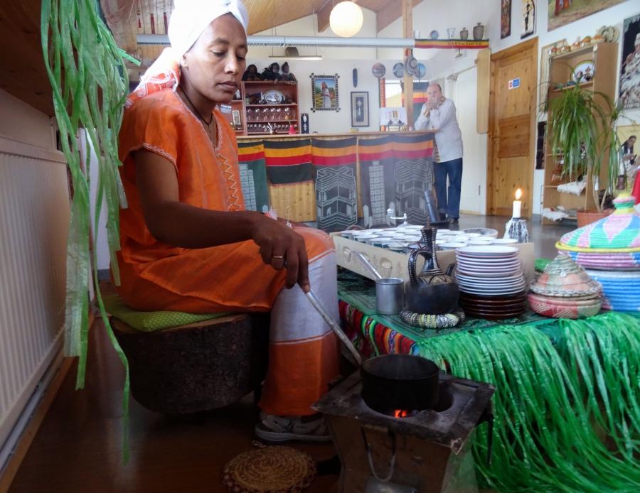 Azeb Kahssay roasts coffee beans in Minilik, the Ethiopian restaurant she co-owns in Flúðir, Iceland.