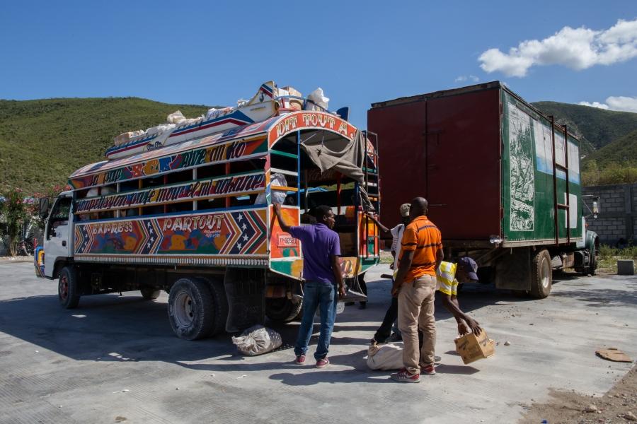 Haitian customs workers inspect a bus in Malpasse, Haiti, near the Dominican border.