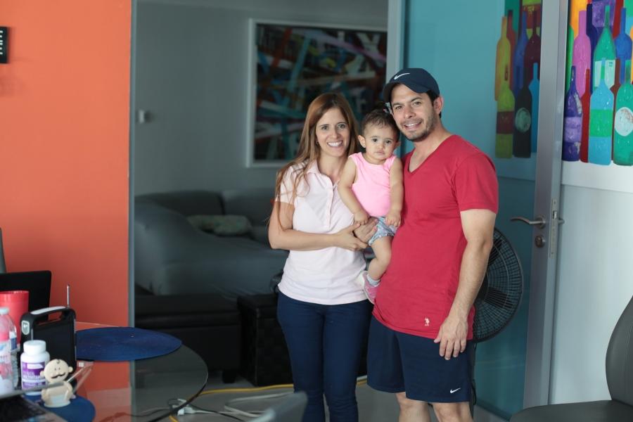 Rosa Lopez and Jose Quiñones, with their daughter Joyce. The new solar battery pack for the family's home cost $10,000, but the outlay means they no longer have to depend on an unreliable grid or an expensive part-time generator.