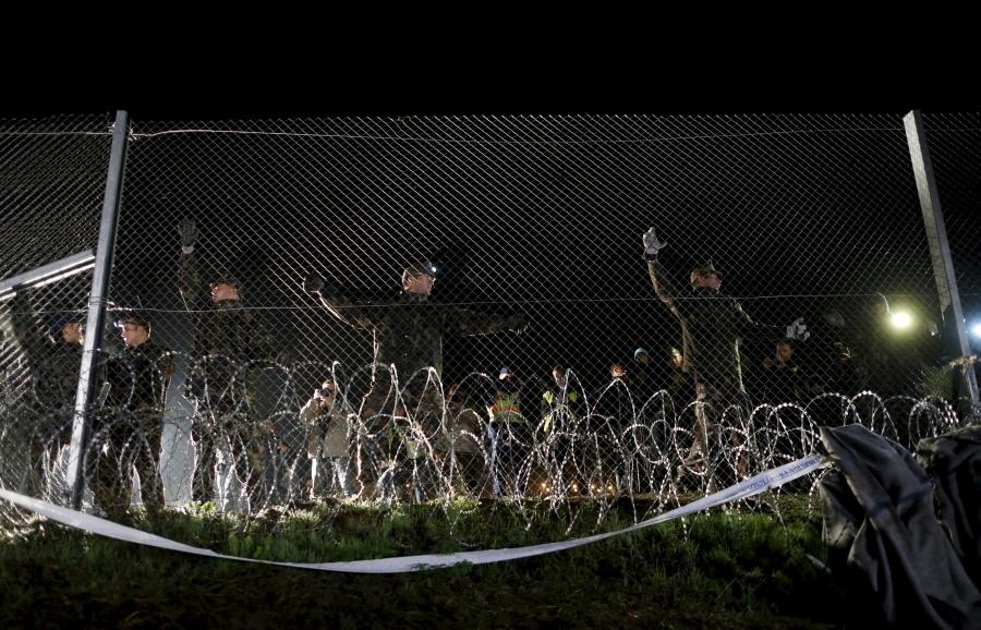 Hungarian soldiers close a border with Croatia near the village of Botovo, Croatia, on Oct. 17, 2015.
