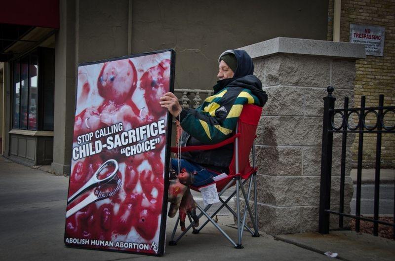 A demonstrator outside Affiliated Medical Services in Milwaukee, Wisconsin.