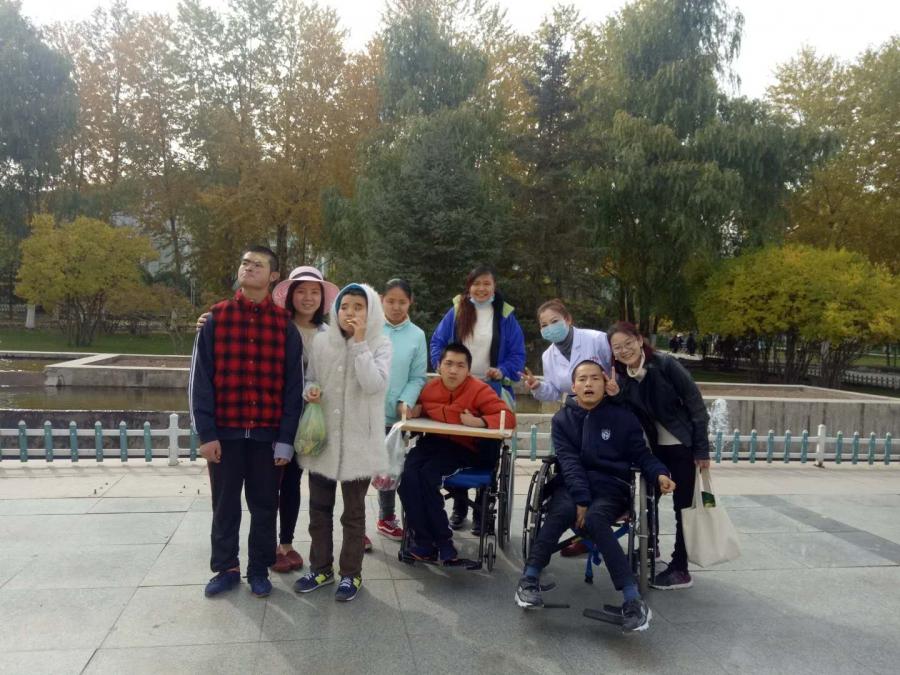 Bingjie Turner and Abigail Anderson with residents at the Xinxin Children's Home
