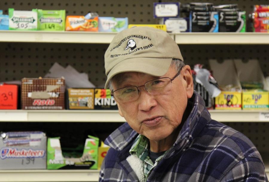 Percy Nayokpuk behind the counter at his store in Shishmaref. He says hunting conditions have changed a lot in his 65 years, but he's encouraged that younger hunters are adapting to new conditions. “We’ve always been hunters here,” Nayokpuk says. “We hunt