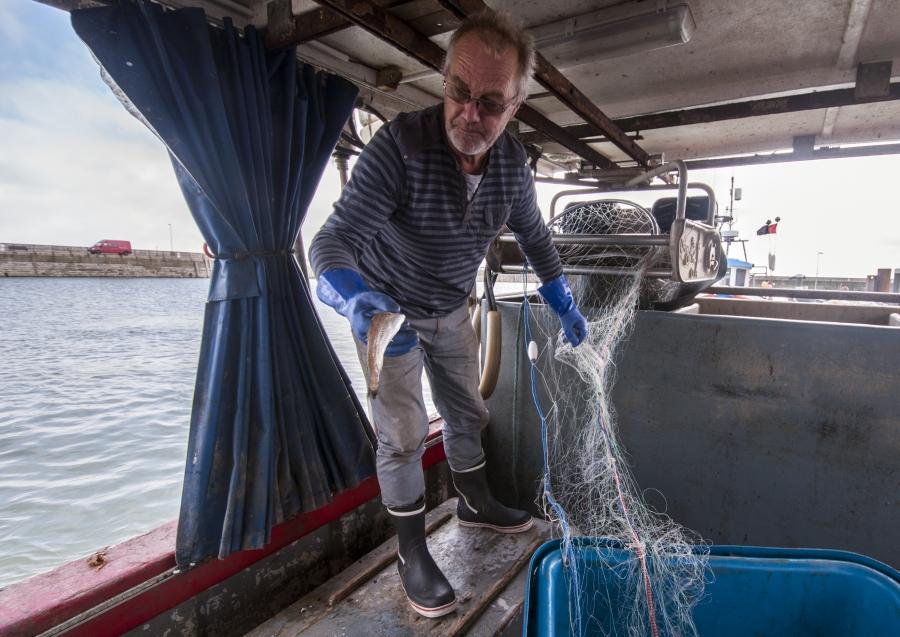 Fisherman Steve Barratt aboard his boat Razorbill in the Ramsgate harbor.