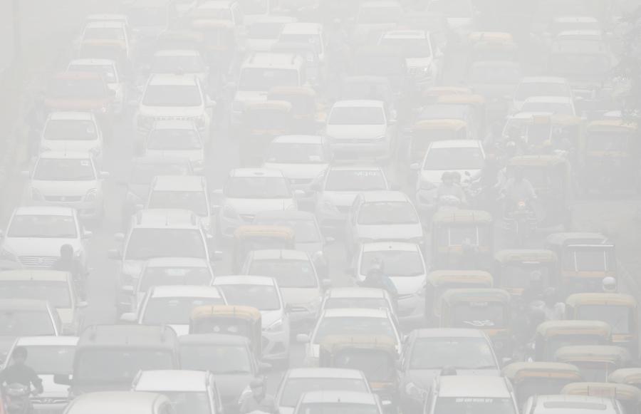 Vehicles drive through heavy smog in Delhi during the peak of the most recent pollution crisis, Nov. 8, 2017.  