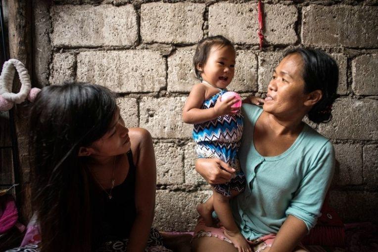 Jazmine Durana now has to depend on her parents to help support her and her daughter Hazel. Image by Martin San Diego. Philippines, 2017. 