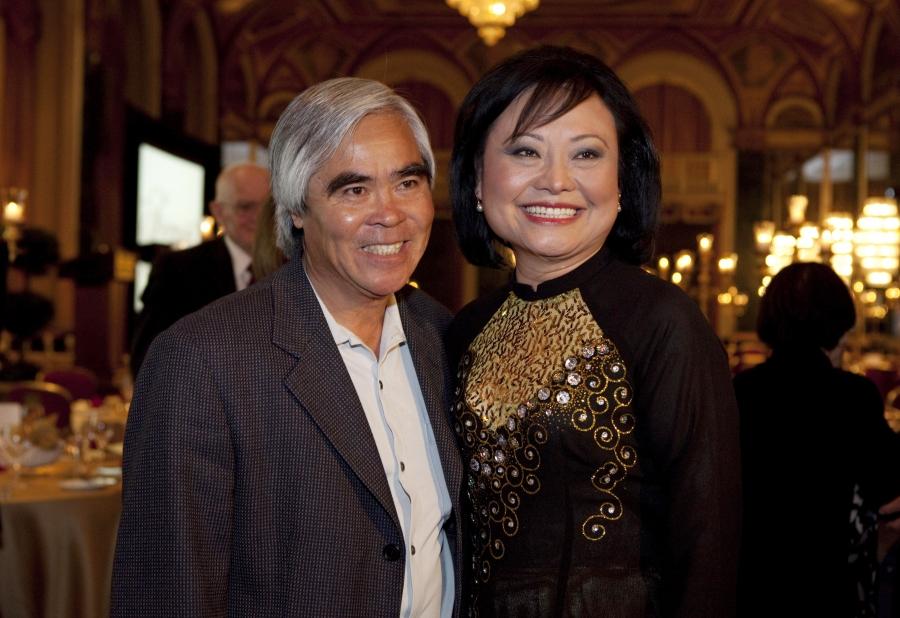 Photojournalist Nick Ut and Kim Phuc Phan Thi pose for pictures at the "40th Anniversary Tribute Dinner in Honor of Kim Phuc Phan Thi" in Toronto, June 8, 2012.  In 1972, Ut took the iconic Vietnam War photograph of a naked Kim Phuc running down a road a