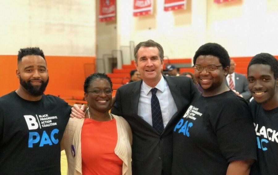 Adrianne Shropshire, second from left, with BlackPAC volunteers and Governor-Elect Ralph Northam, center, in Virginia in November 2017. 