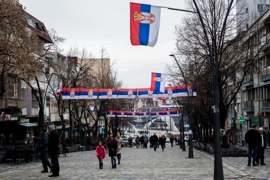 Serbian flags line a pedestrian-friendly road in North Mitrovica, a Serb-majority area in northern Kosovo. The city is split along ethnic lines, divided by the Ibar River. 