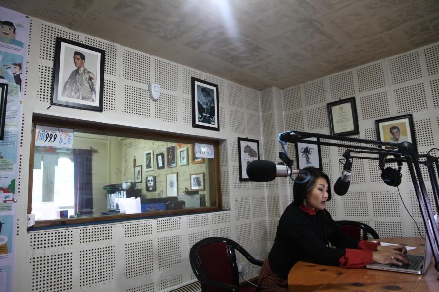 Namgay Zam prepares to record an episode of Mind Over Matter Bhutan in the studio at Radio Valley in Thimphu.