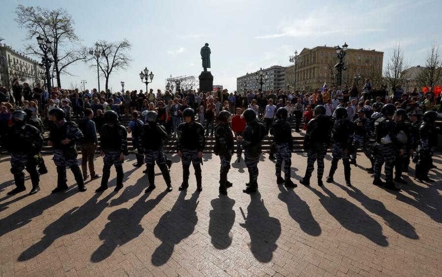 Police officers in riot gear block an area during an opposition protest rally ahead of Vladimir Putin's inauguration ceremony, next to the monument to Russian poet Alexander Pushkin, in Moscow, Russia, May 5, 2018. 