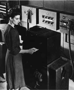 Frances Bilas Spence feeding punch cards into ENIAC, Feb 1946. 