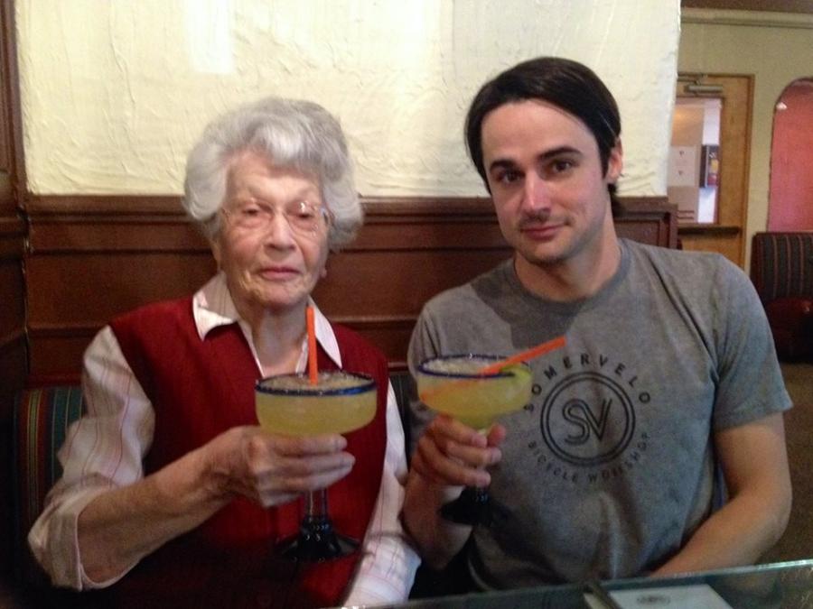 92-year-old Hortensia Campbell and her grandson, Bradley Campbell, toast to good health. 