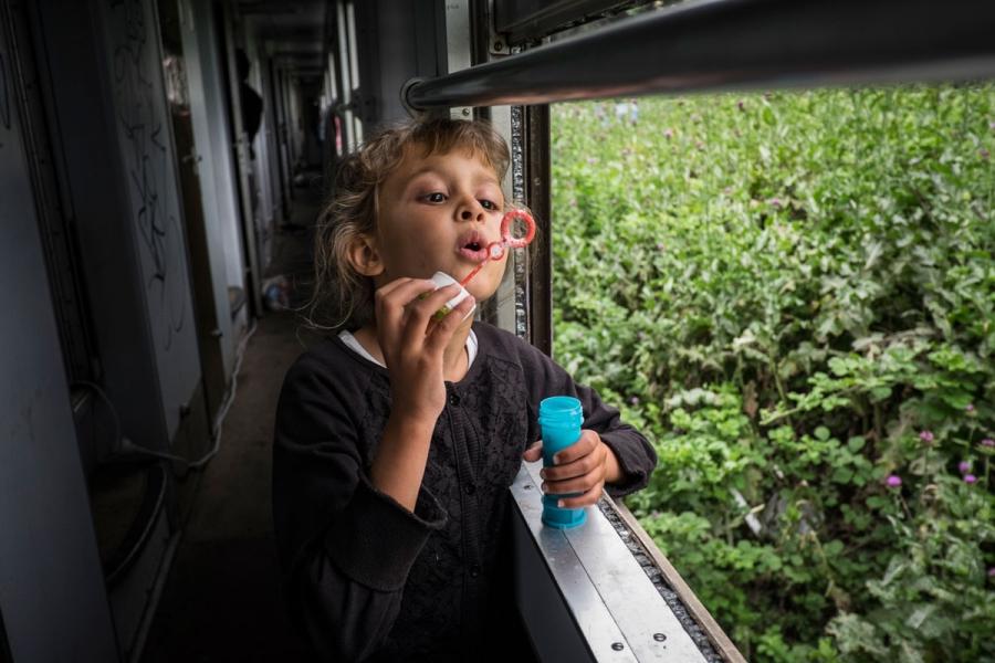 Miriam, 7, a Syrian girl, is living aboard a train parked at Idomeni station, along with her parents and brother.
