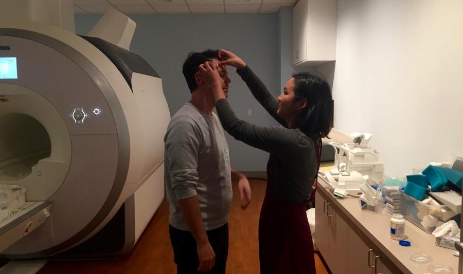 Researcher Lauren Jacobs prepares comedian Anthony Veneziale for a fMRI session at a laboratory run by Dr Charles Limb at the University of California, San Francisco. 