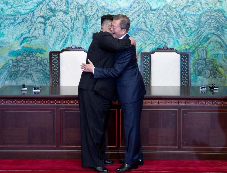 South Korean President Moon Jae-in and North Korean leader Kim Jong-un embrace at the truce village of Panmunjom inside the demilitarized zone separating the two Koreas, South Korea, April 27, 2018.