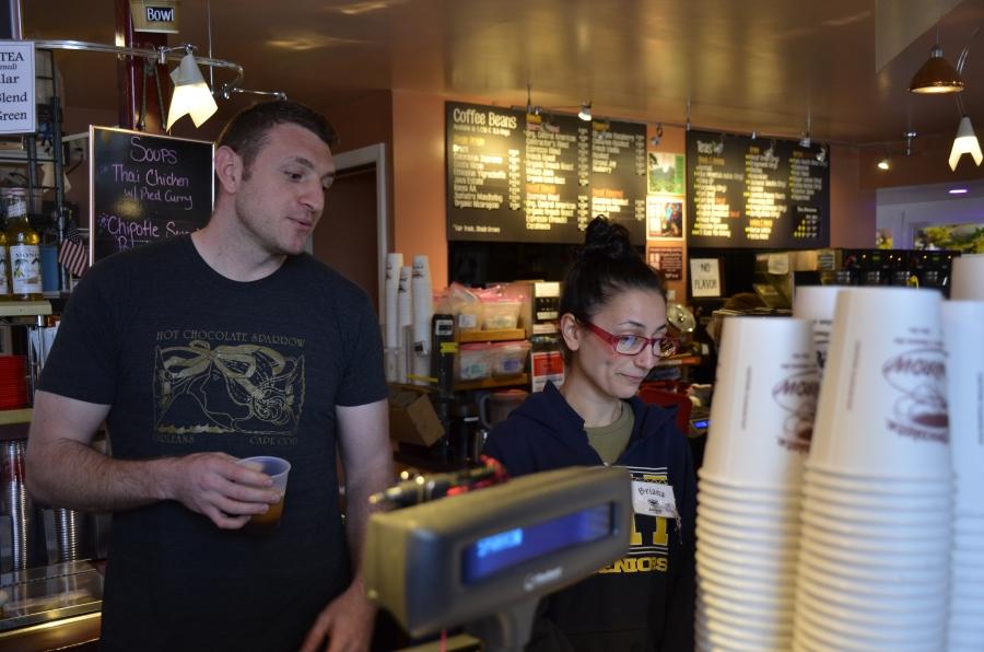 Perry Sparrow (left) and his employee Briana Trafuoci behind the counter at the Hot Chocolate Sparrow. In part due to the high cost of housing on the Cape, Sparrow says there’s not enough local seasonal workers to hire. 
