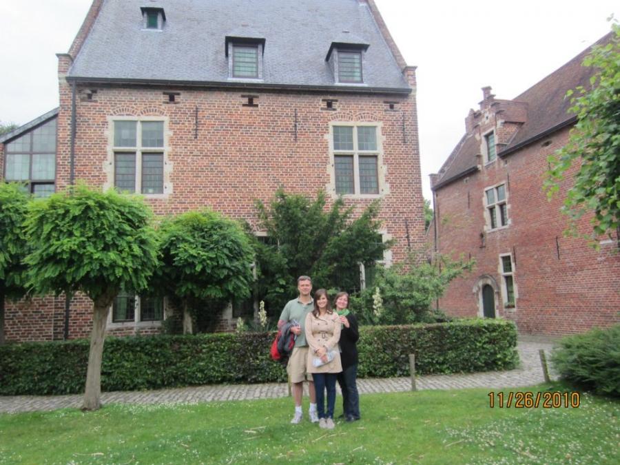 Karolina Chorvath and her parents, Igor and Kim, standing in front of their previous home in Leuven, Belgium where Karolina was born. 