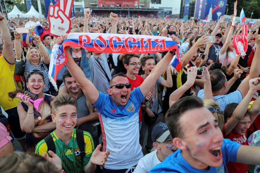 Russia fans celebrate as the Russian national soccer team scores in a 5-0 victory over Saudi Arabia to open the 2018 World Cup, in Rostov-on-Don, Russia, June 14, 2018.