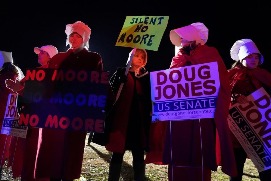 Women protest at the exit gate after a Roy Moore campaign rally in Midland City, Alabama, December 2017. Moore, the Republican candidate for the Alabama senate seat previously held by Jeff Sessions, lost to Democrat Doug Jones.
