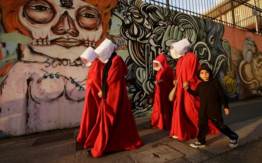 Activists dressed as handmaids take part in a demonstration against the proposed policies of the presidential candidate Fabricio Alvarado, an evangelical Christian of the National Restoration party in San Jose, Costa Rica, in March 2018.