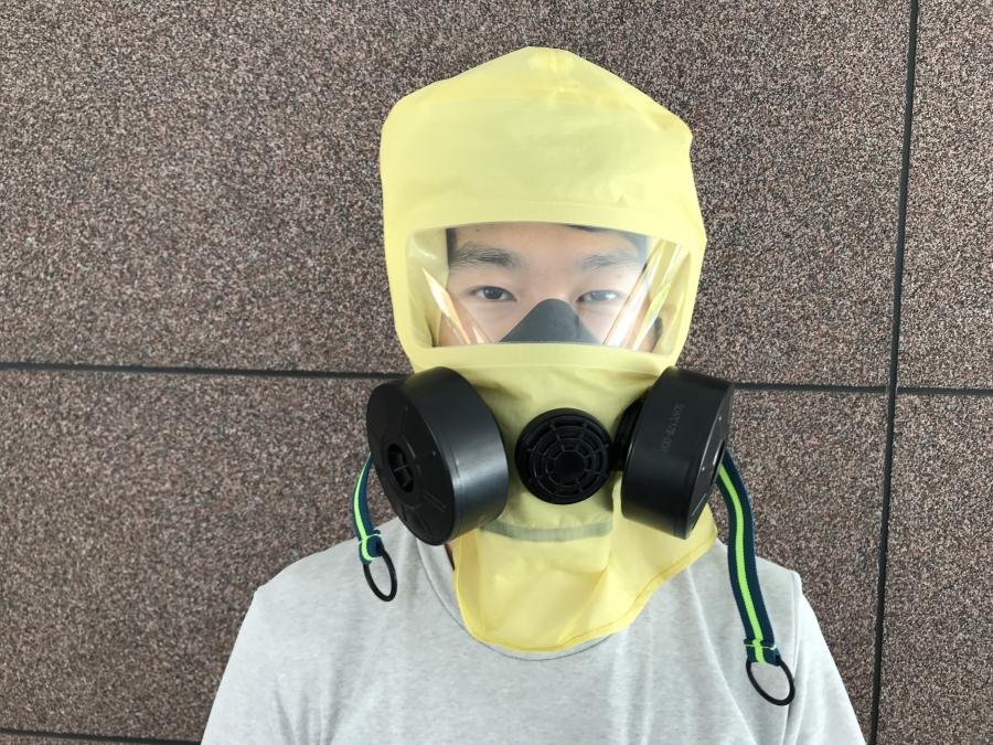 a south korean man models a gas mask