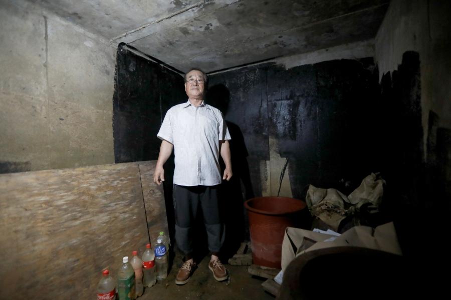 a man stands in a private bunker in south korea