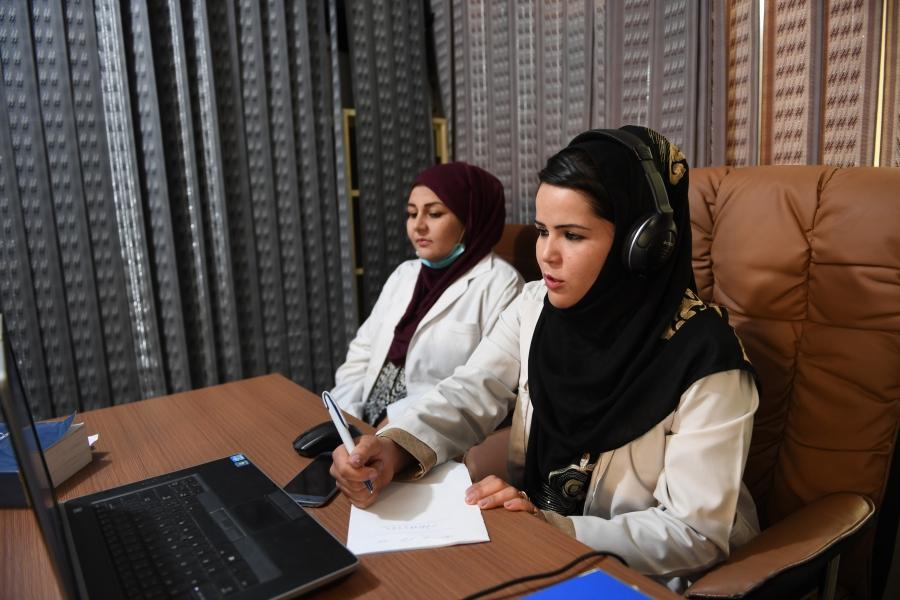 Midwives take calls at the Midwifery Helpline Center in Kabul, Afghanistan.