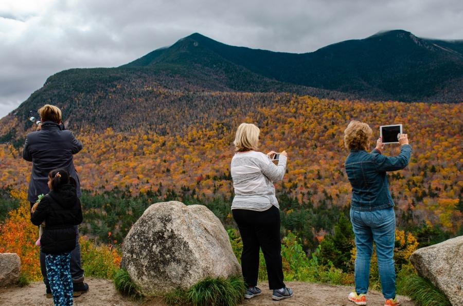 The 34-mile Kancamagus Highway, a path cut through New Hampshire’s White Mountain National Forest, is one of the most popular leaf peeping spots in New England. 
