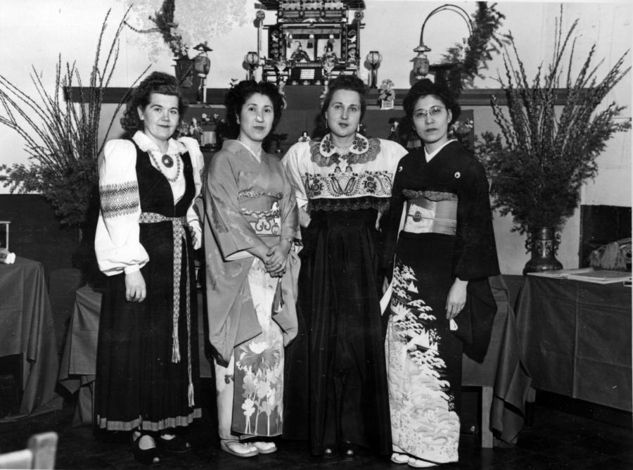 Four women, ornately dressed, two in Japanese dress and two Estonian. Black and white photo