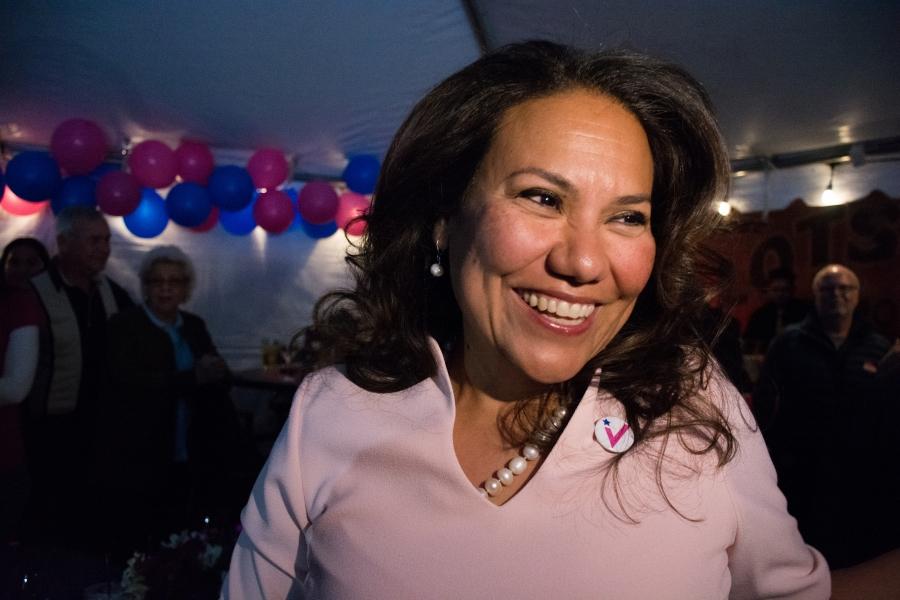 Veronica Escobar smiles and looks to the right 