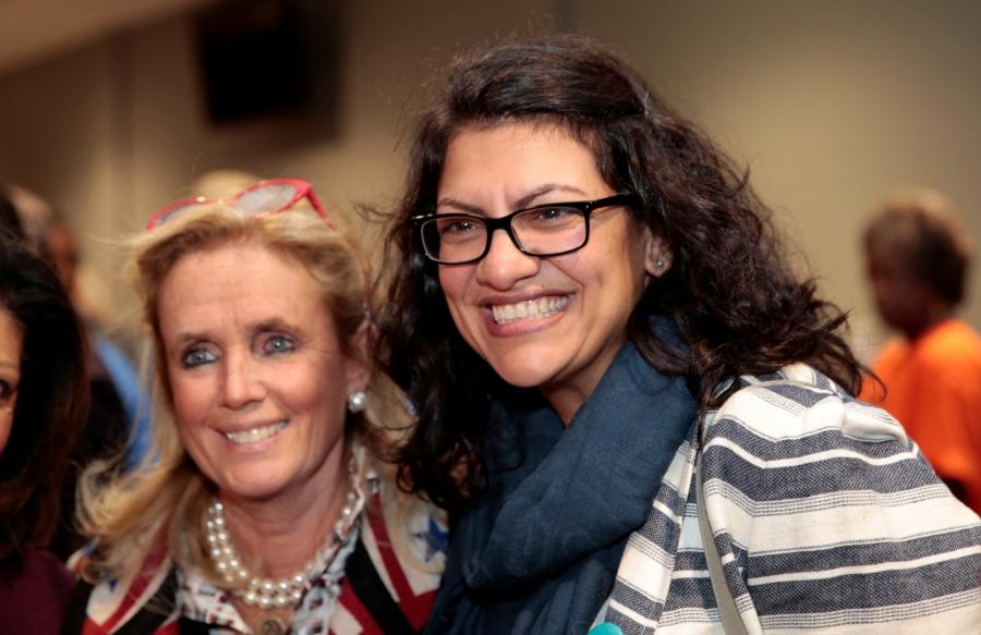 Representative-elect Rashida Tlaib, right, poses for a photograph with US Democratic Congresswoman Debbie Dingell smile with their arms around each other 