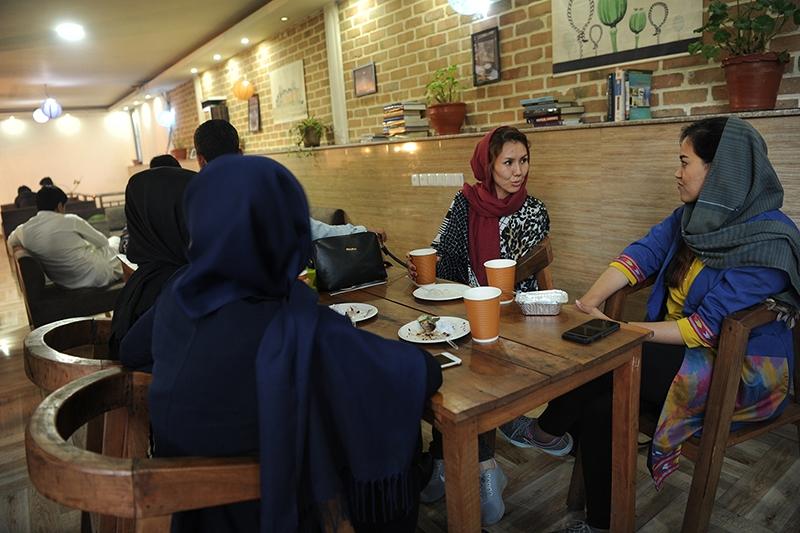 Young men and women enjoy an afternoon at the ICafe in Kabul, Afghanistan.