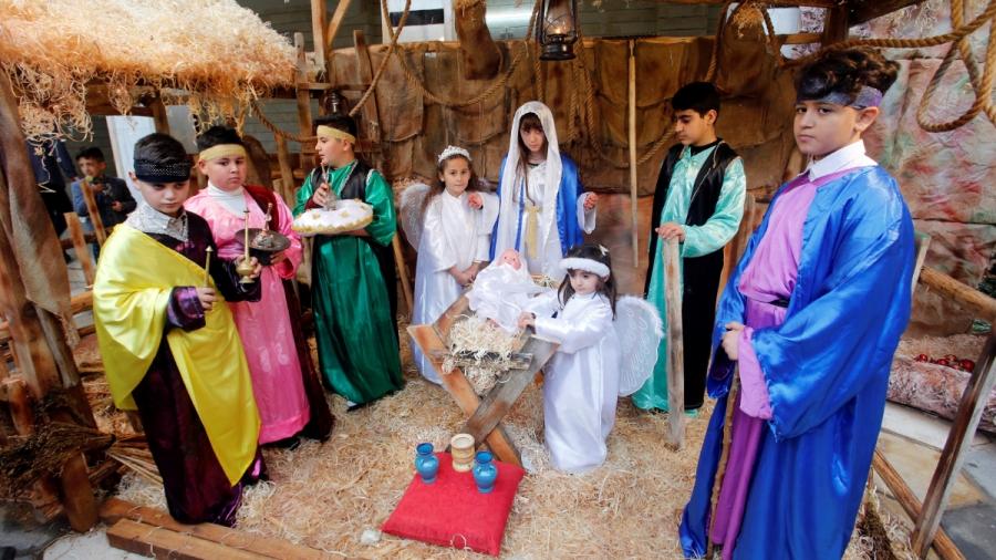 Eight children represent the Nativity scene, dressing as Mary, Joseph, the three Kings, shepherds and angels.