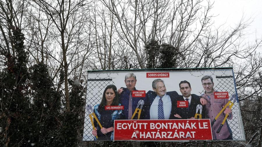 A billboard shows billionaire George Soros and other Hungarian opposition leaders. 