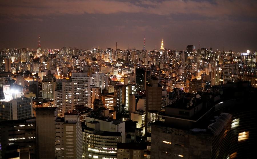 A dense cityscape at night