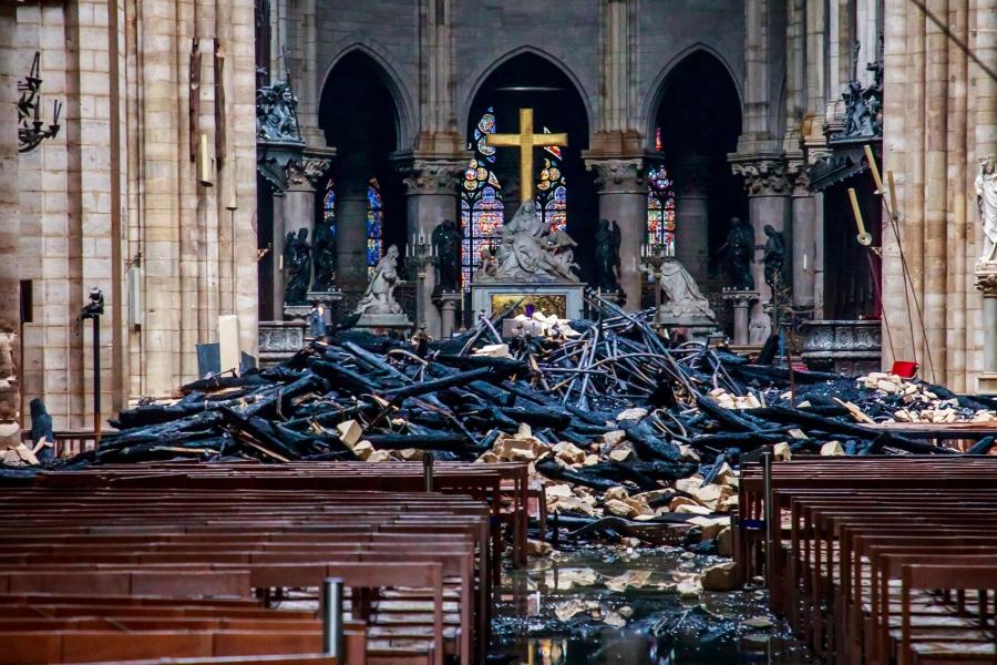 Blackened rubble fills the front of a church