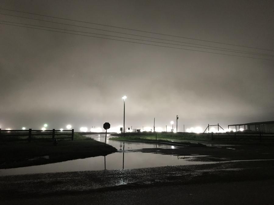 Flood lights at the nation’s largest migrant family detention facility illuminate the night sky near the south Texas town of Dilley.