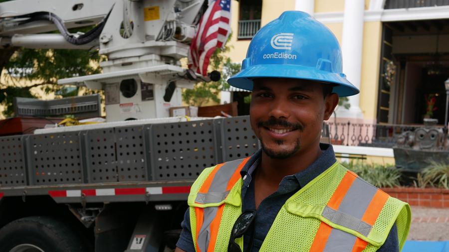 Con Edison crew supervisor Richard Gonzalez oversees linemen fixing the grid in Old San Juan. He says he can hear announcements on the radio for residents to honk at Con Ed trucks to show their appreciation. 