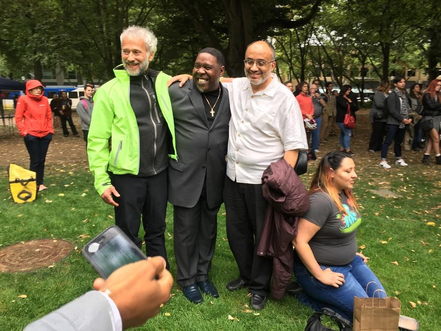 Wajdi Said, right, stands with other Portland activists in a city park. Said is president and co-founder of the Muslim Educational Trust.